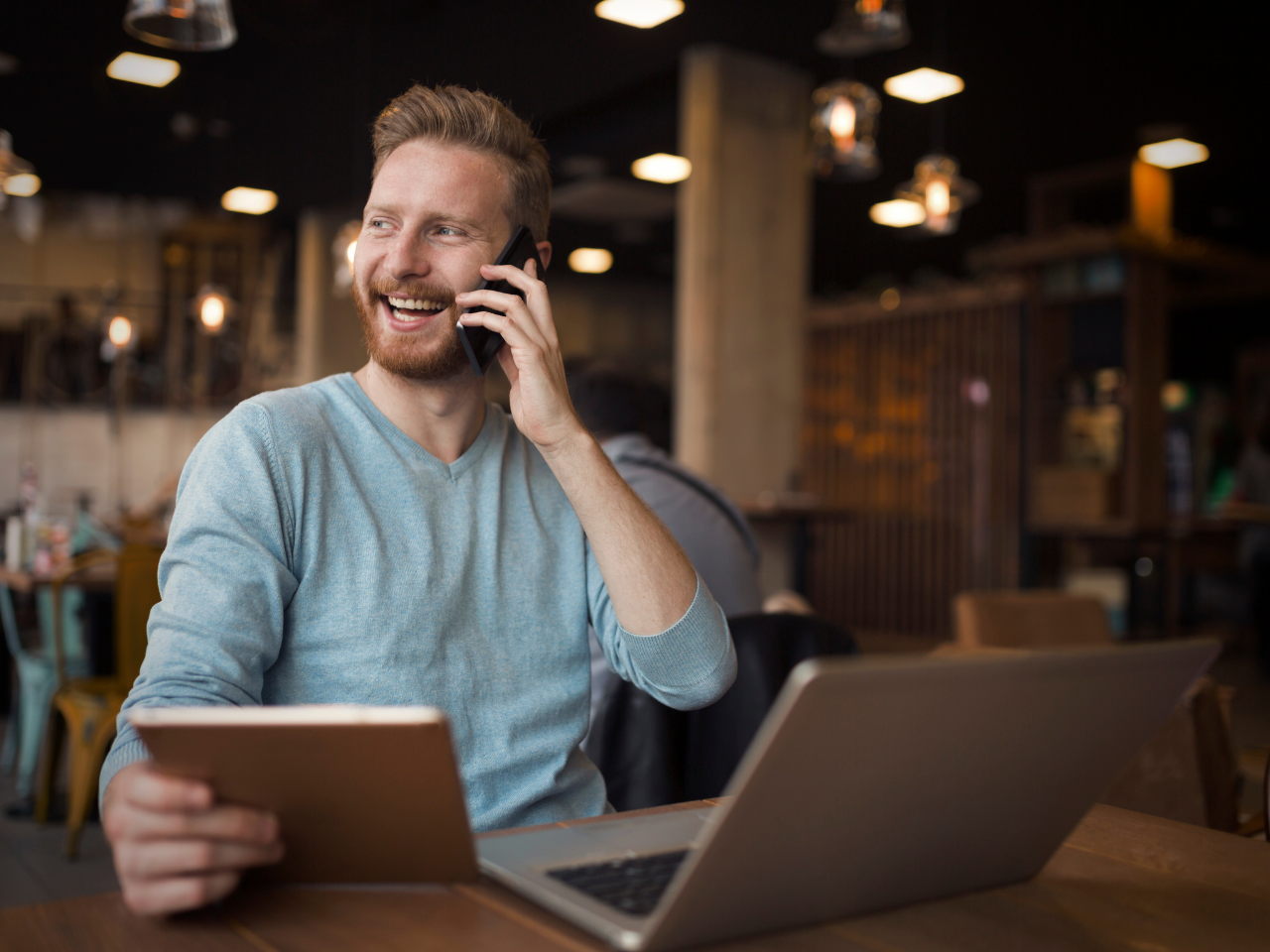 A loan officer on the phone with a client