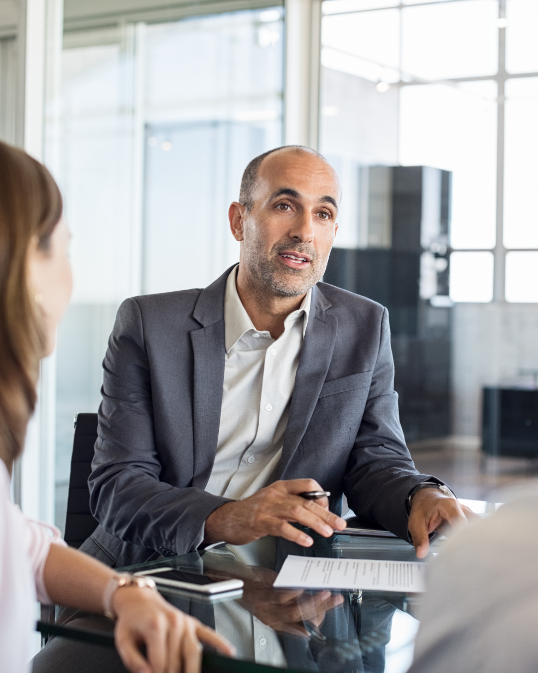 A loan originator working through the Perfect Loan Process with a client